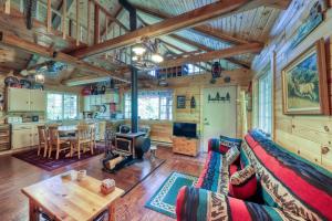 a living room with a couch and a table at The Creekside Cabin in Cascade