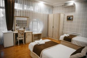 Ένα ή περισσότερα κρεβάτια σε δωμάτιο στο Shahlo Hotel