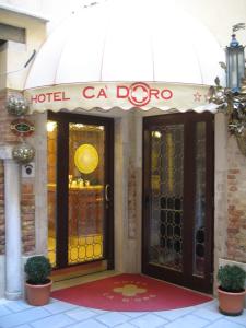 a hotel entrance with a hotel ca dooco sign on it at Hotel Ca' D'Oro in Venice