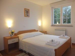 Postel nebo postele na pokoji v ubytování Guesthouse Villa AnnaDora