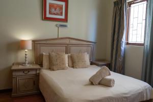 Postel nebo postele na pokoji v ubytování Bay Vista Guesthouse