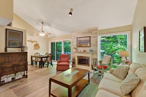 a living room with a couch and a fireplace at Harbor Cove #9 in Harbor Springs