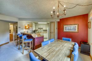 a dining room and kitchen with a table and chairs at Powderhorn Corner & Vista in Breckenridge