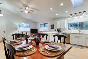 a kitchen and dining room with a table and chairs at Perfectly Placed Plum Cottage in Bend