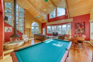 a pool table in a living room with red walls at 161 Emmett Lode in Breckenridge