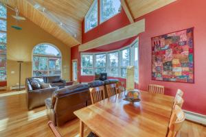 a dining room with a table and a couch at 161 Emmett Lode in Breckenridge