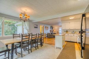 a kitchen and dining room with a table and chairs at White Lobster Cottage in Greenville