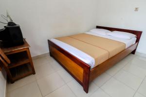 Rúm í herbergi á Hotel Wismancala Kaliurang
