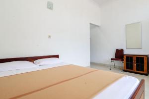 Rúm í herbergi á Hotel Wismancala Kaliurang