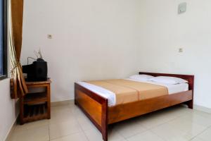 Rúm í herbergi á Hotel Wismancala Kaliurang