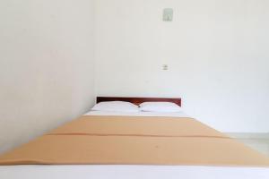 Rúm í herbergi á Hotel Wismancala Kaliurang