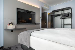 Cama ou camas em um quarto em Holiday Inn - the niu, Charly Frankfurt City by IHG