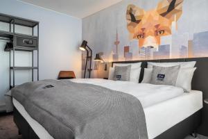 Cama ou camas em um quarto em Holiday Inn - the niu, Charly Frankfurt City by IHG
