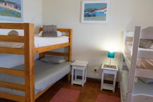 Postel nebo postele na pokoji v ubytování Bay Vista Guesthouse