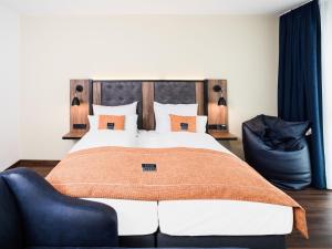 Postel nebo postele na pokoji v ubytování Holiday Inn - the niu, Saddle Fürth by IHG