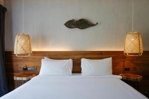 Кровать или кровати в номере Nature Beach Resort +37 фотографий