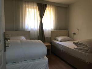 Postel nebo postele na pokoji v ubytování Kalkedon Hostel