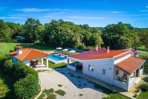 an aerial view of a house with a swimming pool at House Casetta Filip in Krnica