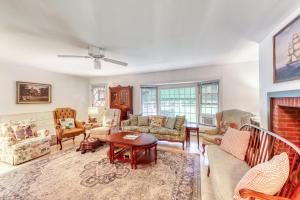 a living room filled with furniture and a fireplace at The CAVU Mansion on Bellevue in Oklahoma Heights