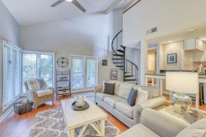 a living room with a couch and a table at St Andrews Common in Hilton Head Island