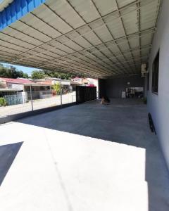 an empty parking lot with a large white ceiling at Aqua Shelter in Mersing