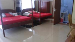 Postel nebo postele na pokoji v ubytování RoseVilla Hotel