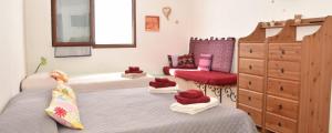 Postel nebo postele na pokoji v ubytování ECO Affittacamere Casa Maica Eco guesthouse