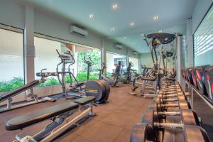 a gym with a row of treadmills and machines at AKIRA Lipe Resort in Ko Lipe