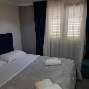 Postel nebo postele na pokoji v ubytování Hotel Erandi