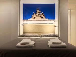 Postel nebo postele na pokoji v ubytování Casa Terrazza Colosseo + 31 fotografií