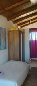 Postel nebo postele na pokoji v ubytování ECO Affittacamere Casa Maica Eco guesthouse