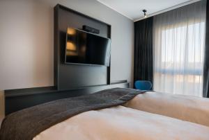 Voodi või voodid majutusasutuse Holiday Inn - the niu, Square Mannheim by IHG toas