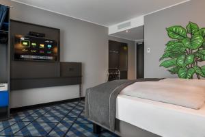 Voodi või voodid majutusasutuse Holiday Inn - the niu, Square Mannheim by IHG toas