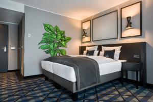 Voodi või voodid majutusasutuse Holiday Inn - the niu, Square Mannheim by IHG toas