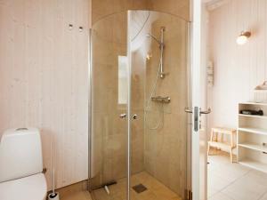 a shower with a glass door in a bathroom at 4 person holiday home in Slagelse in Slagelse