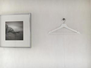 a picture hanging on a wall with a hanger at Chalet Zeekraal in Buren