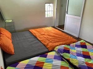 Postel nebo postele na pokoji v ubytování Bao Loc Homestay