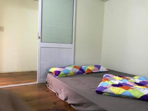 Postel nebo postele na pokoji v ubytování Bao Loc Homestay