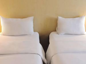 Letto o letti in una camera di Ibis Padang