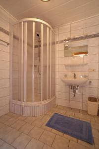 a bathroom with a shower and a sink at Ferienwohnung Krug in Wenns