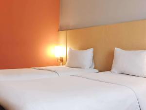 Letto o letti in una camera di Ibis Padang