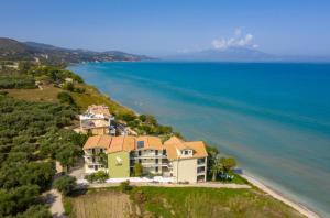 an aerial view of a house on a hill next to the ocean at Sea View Hotel in Alykes