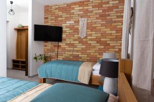 Postel nebo postele na pokoji v ubytování BURINA plant-based residence