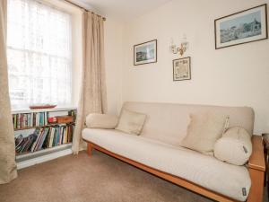 a living room with a couch and a window at 7 Glendower Street in Monmouth