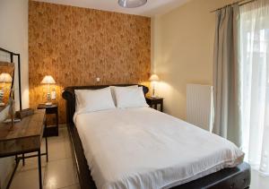 מיטה או מיטות בחדר ב-V Luxury Apartment 1