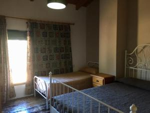 Posteľ alebo postele v izbe v ubytovaní Casa Rural Monterrey Aroche