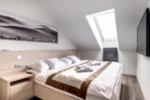 Postel nebo postele na pokoji v ubytování HOTEL PECR DEEP