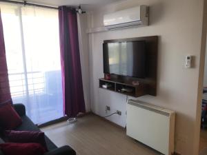 TV a/nebo společenská místnost v ubytování Vista Apartments - Aire Acondicionado y Estacionamiento