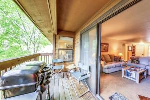 a screened in porch with a view of a living room at Sonoma Getaway in McCall