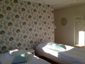 Postel nebo postele na pokoji v ubytování Västerbacken Hotell & Konferens